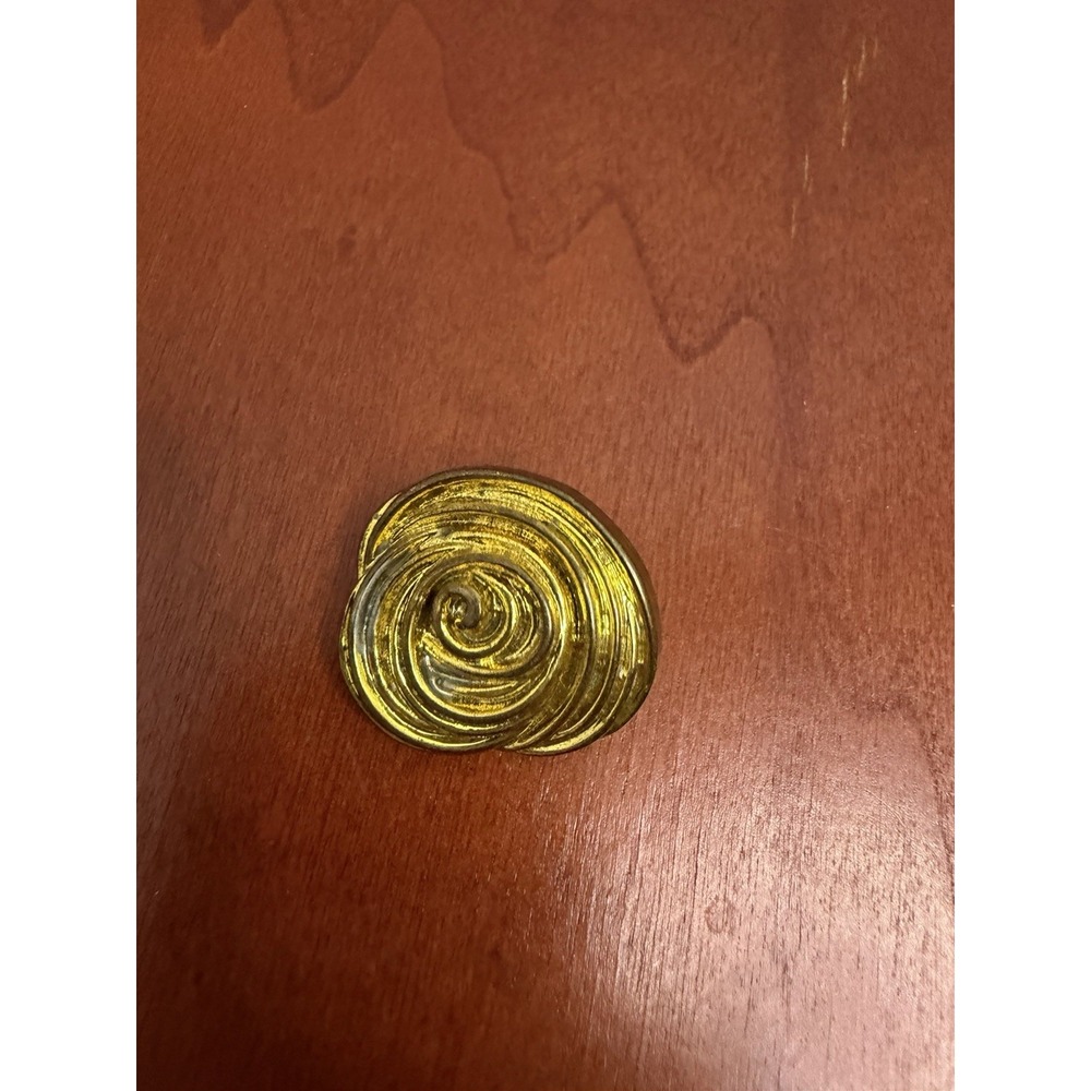 a vintage gold spiral shank button